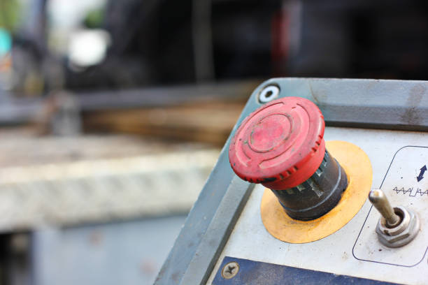 istock close up red button of asphalt paver machine ,safety button 1279759554