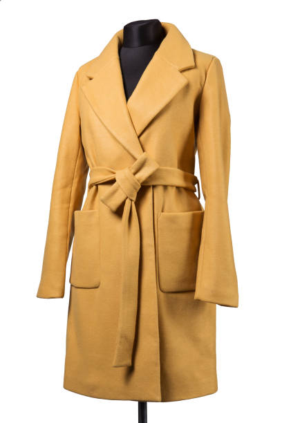 istock yellow female cashmere coat on a mannequin, on a white background 1279765106