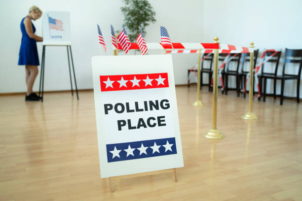 istock A woman voting at Election Day 1279766432