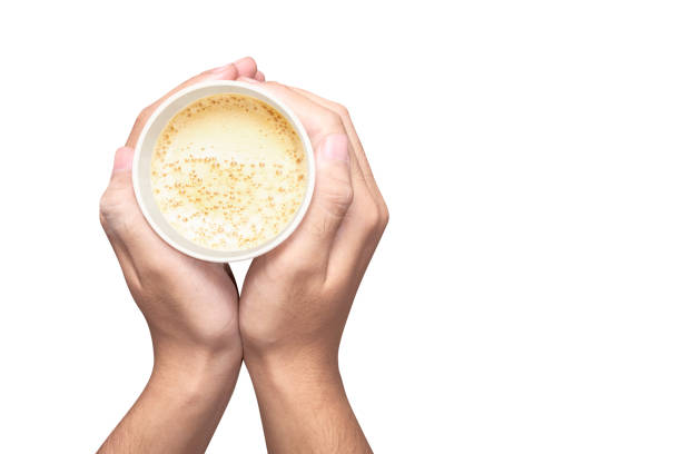 Human hands holding cup of coffee isolated over white background