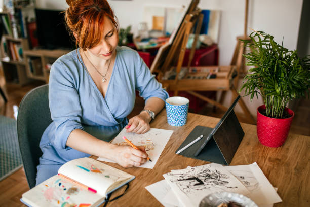 istock Graphic designer woman doing sketches 1279766984