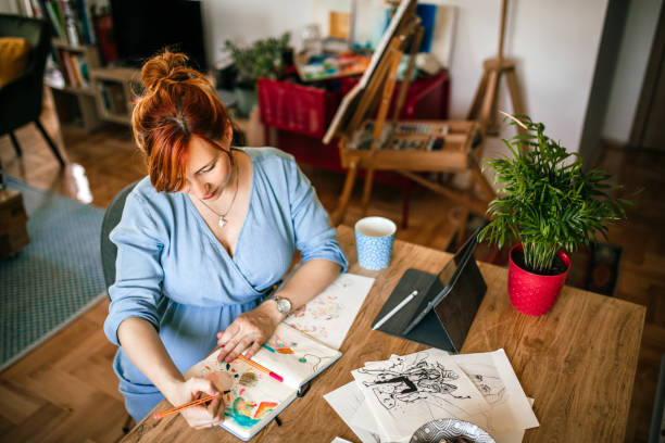 istock Graphic designer woman doing sketches 1279767043