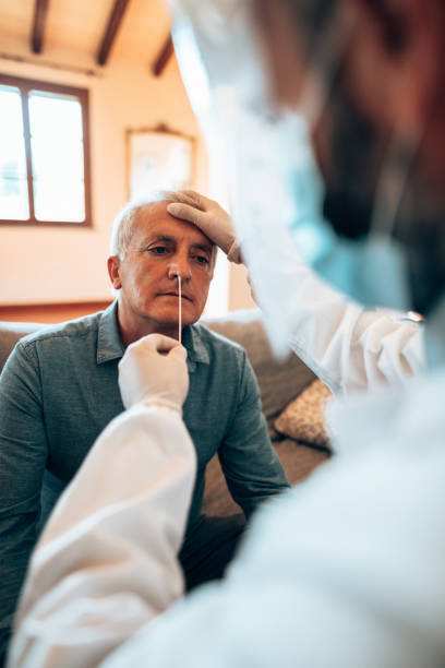 istock doctor doing the tampon to a patient at home 1279768310