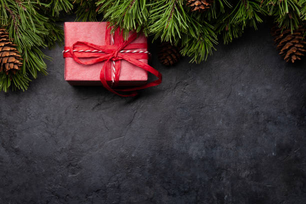 istock Christmas greeting card with fir tree and gift box 1279768580