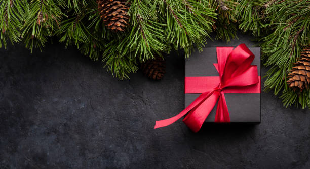 istock Christmas greeting card with fir tree and gift box 1279768608
