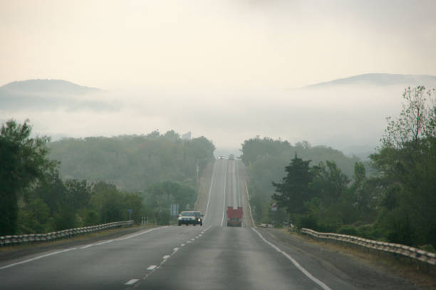 istock Asphalt road with moving cars 1279770413