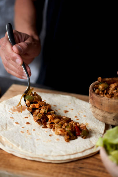 istock man preparing a durum or a burrito 1279771198