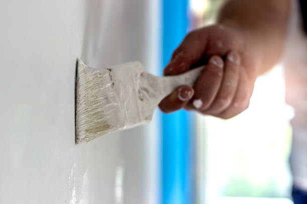 istock Painting apartment, renovating with white color. 1279771364