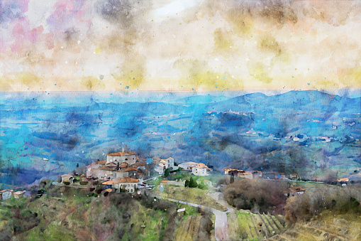 Watercolor painting effect on a photo of old medieval village Smartno, Goriska Brda region, Slovenia. View of the village in the front, surrounded by the vineyards and other villages in the background and Trieste gulf in the distance. Watercolor effect on a photography.