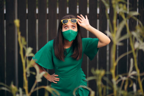Curious Woman Wearing Face Mask Taking Off Her Sunglasses