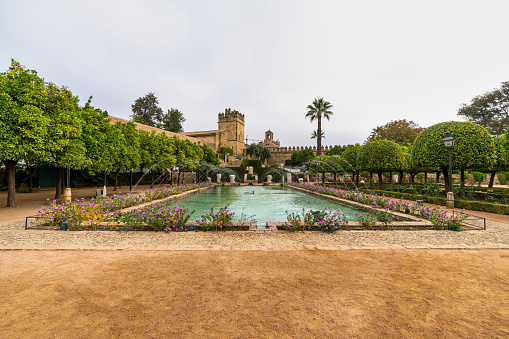 Cordoba, Spain - October 31, 2019: View of the gardens of the Alcazar of the Christian Monarchs, Alcazar de los Reyes Cristianos in Cordoba, Andalusia, Spain