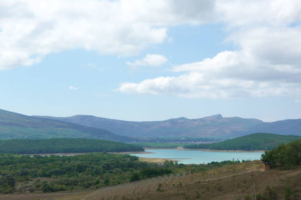 istock Landscape with lake and mountains 1279775771