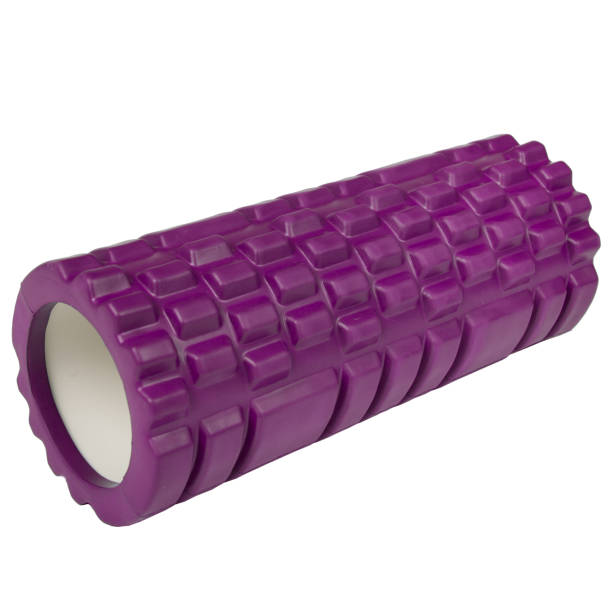 Athletic massage roller pink color isolated on white background. Foam roller pink gym fitness equipment for massage Isolated on white background. roller ball stock pictures, royalty-free photos & images
