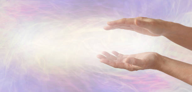 istock Channelling beautiful soft golden healing energy between hands 1279777861