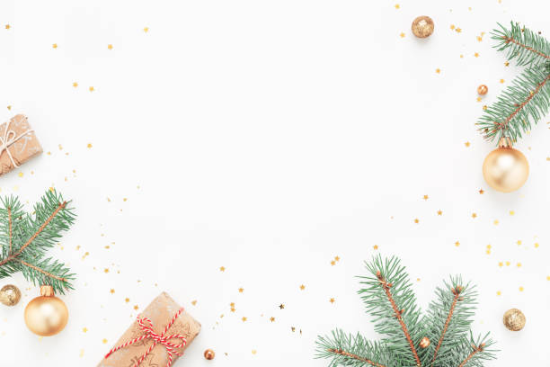 istock Christmas frame of green branches, gifts, decorations on white background. 1279778888