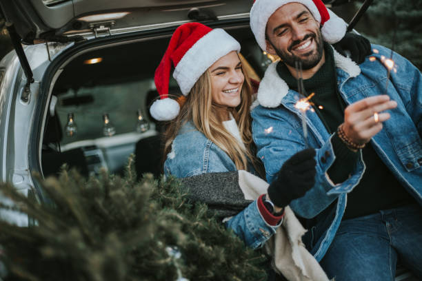 istock Couple having fun on Christmas tree adventure. 1279779126