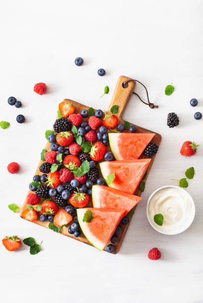 istock fruit and berry platter over white. blueberry, strawberry, raspberry, blackberry, watermelon 1279779187