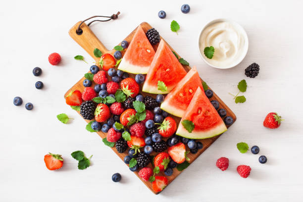 istock fruit and berry platter over white. blueberry, strawberry, raspberry, blackberry, watermelon 1279779200