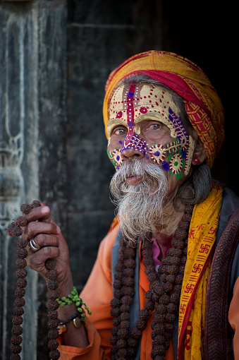 Unidentified sadhu poses for camera in the street of Bhaktapur, Nepal.
