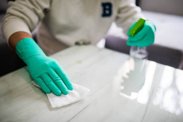 istock Deep cleaning for Covid-19 disease Alcohol, disinfectant spray on table. 1279784011