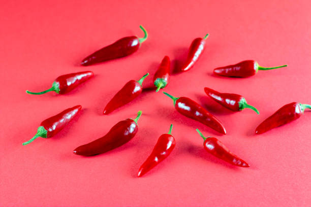 istock Red hot chili peppers on old wooden table 1279785259