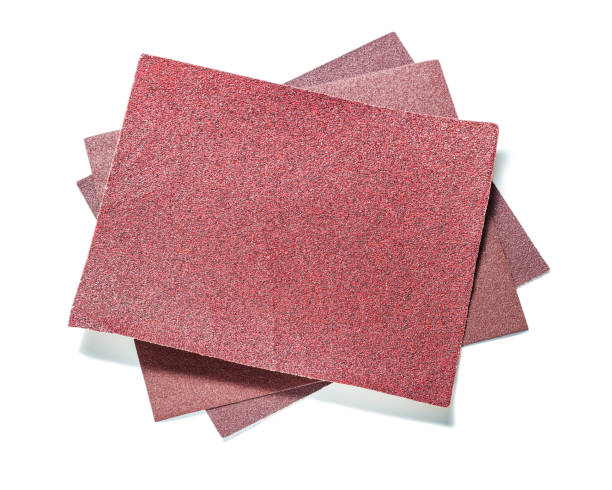 three red sheet of abrasive paper isolated on white - crimped imagens e fotografias de stock