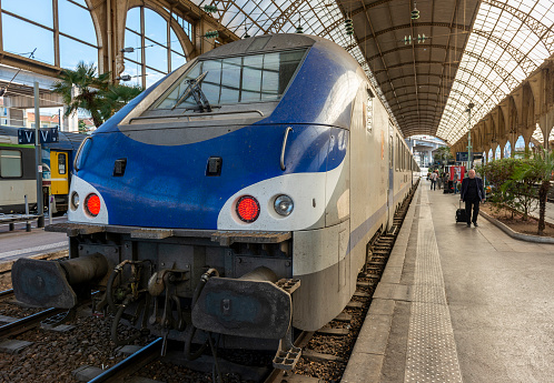 Nice, France - May 26, 2014: Train and passengers waiting at the train station in Nice, France.