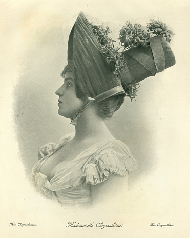 Antique photograph, Portrait of a young woman wearing hat decorated with chrysanthemum. Victorian, 19th Century.