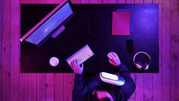 istock Young bearded man in VR-headset playing a game 1279793745