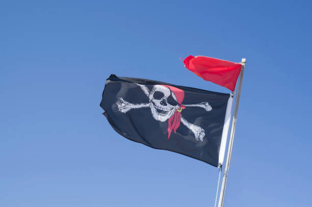 istock Blackjack with grinning skull and red flag in the sky 1279794043