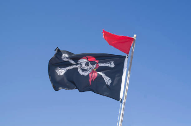 istock Blackjack with grinning skull and red flag in the sky 1279794044