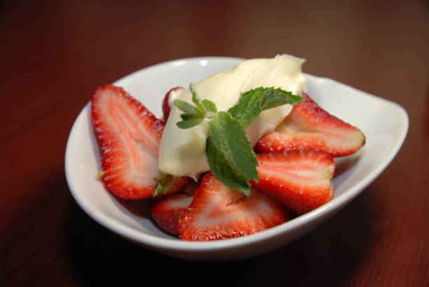 istock Strawberry dessert with cream and mint 1279795100