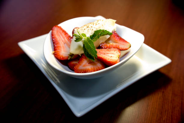 istock Strawberry dessert with cream and mint 1279795136