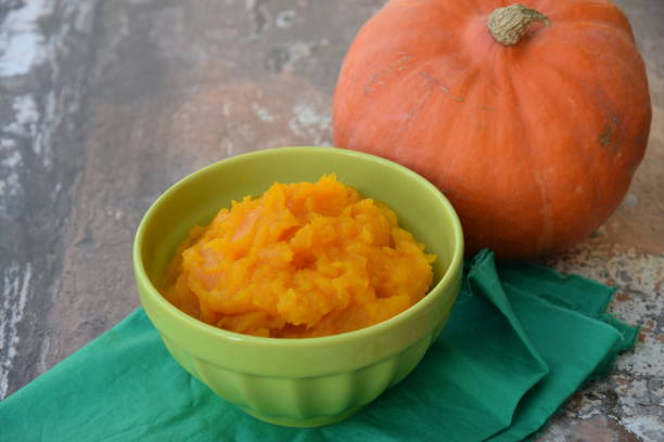 istock Pumpkin puree in a bowl with fresh pumpkin 1279796063