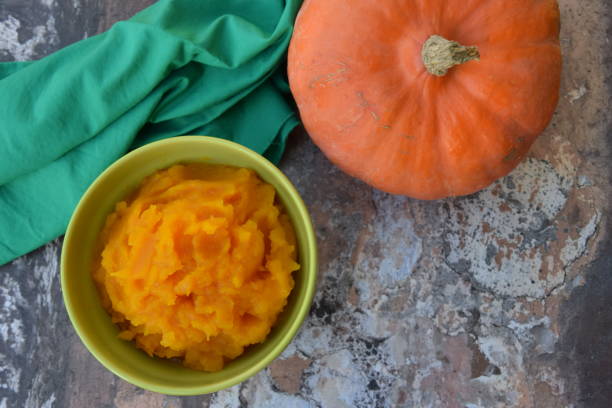 istock Pumpkin puree in a bowl with fresh pumpkin 1279796099