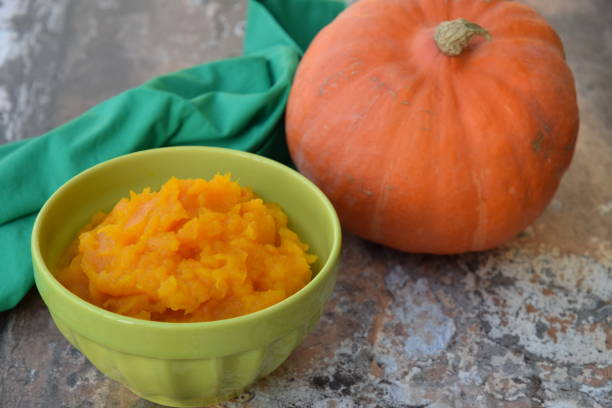 istock Pumpkin puree in a bowl with fresh pumpkin 1279796203