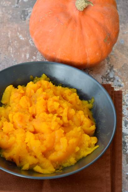 istock Pumpkin puree in a bowl with fresh pumpkin 1279796229
