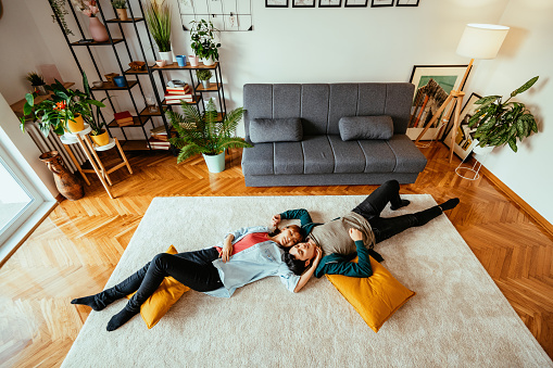 Young millennial Japanese couple at home