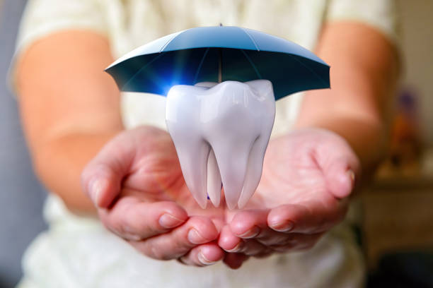 A tooth under an umbrella stock photo