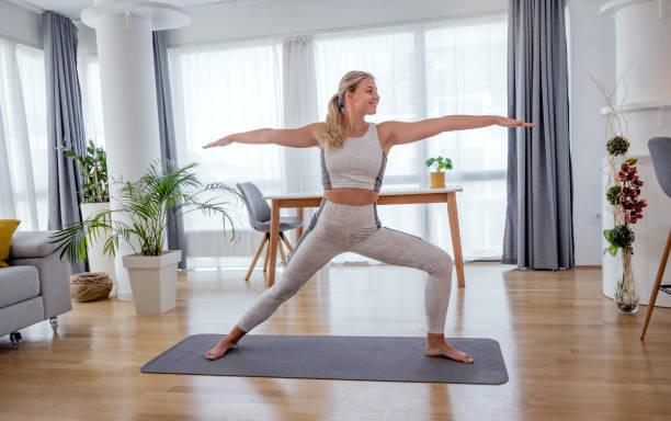 istock Beautiful active young woman workout at home. 1279800449