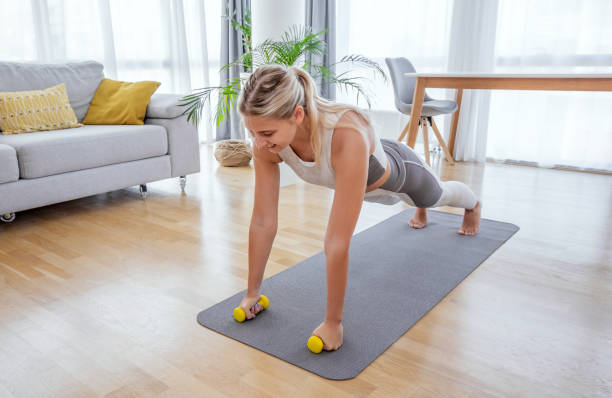 istock Beautiful active young woman exercise at home. 1279800473