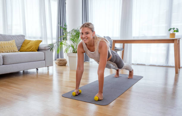 istock Beautiful active young woman exercise at home. 1279800487