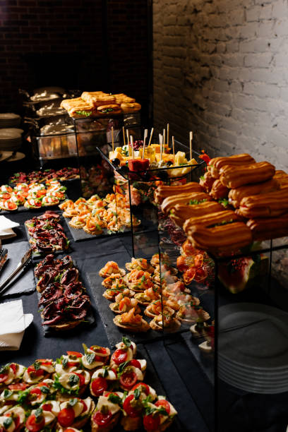 istock Tasty food and drink on black table for event 1279801192