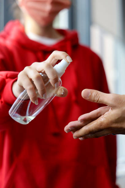 istock Washing hands with alcohol gel or antibacterial soap sanitizer 1279801296