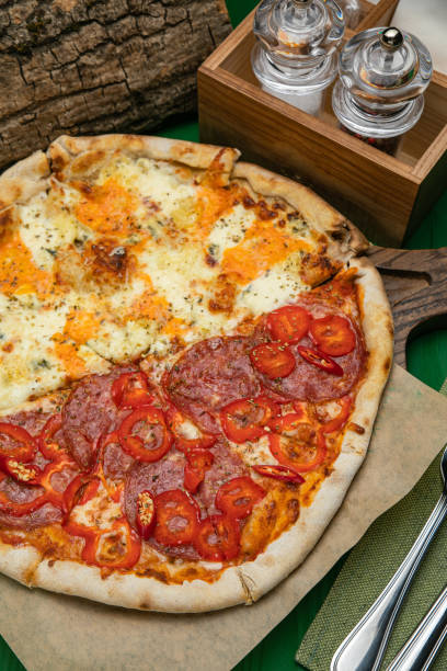 istock pizza with salami, cheese, tomatoes 1279801372