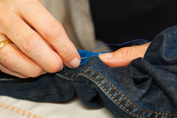 istock Caucasian senior woman sewing and patching jeans pants 1279803698