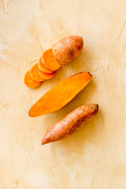 istock Pattern with sweet potato - yams. Organic vegetables background, overhead view 1279804244