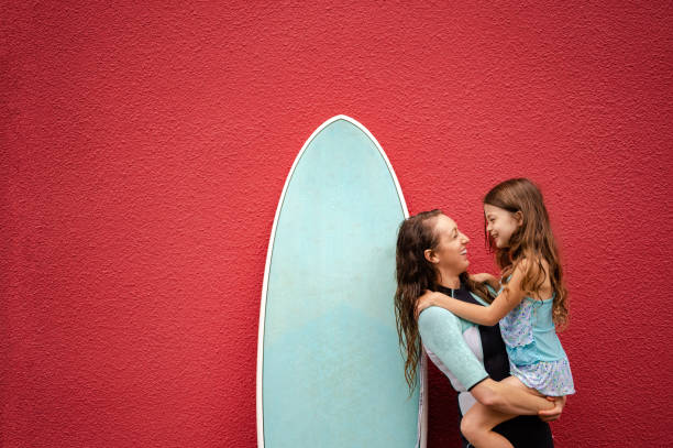 Female surfer with her daughter