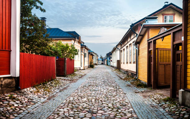 Quaint street with colorful old wooden houses in Rodelokka, on a warm sunny autumn day, with shadows and highlights on walls, Oslo, Norway