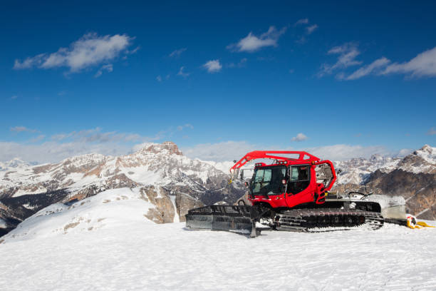 istock Red snowcat ratrack mountain panorama 1279805545
